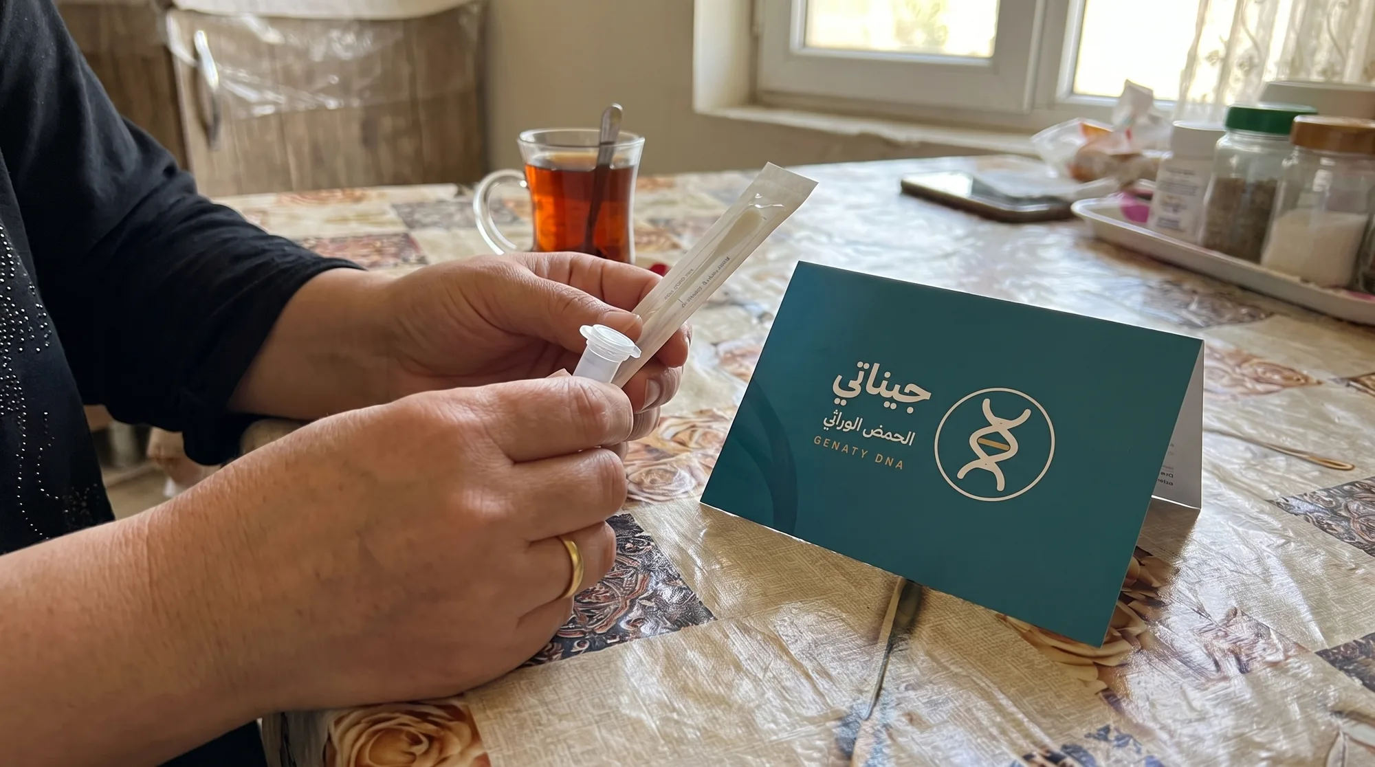 A Geneti sample kit on a table in a bright Iraqi home